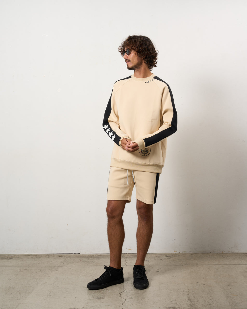 TRストレッチポンチ ラインストーン ターゲットベア ラインスエットシャツ