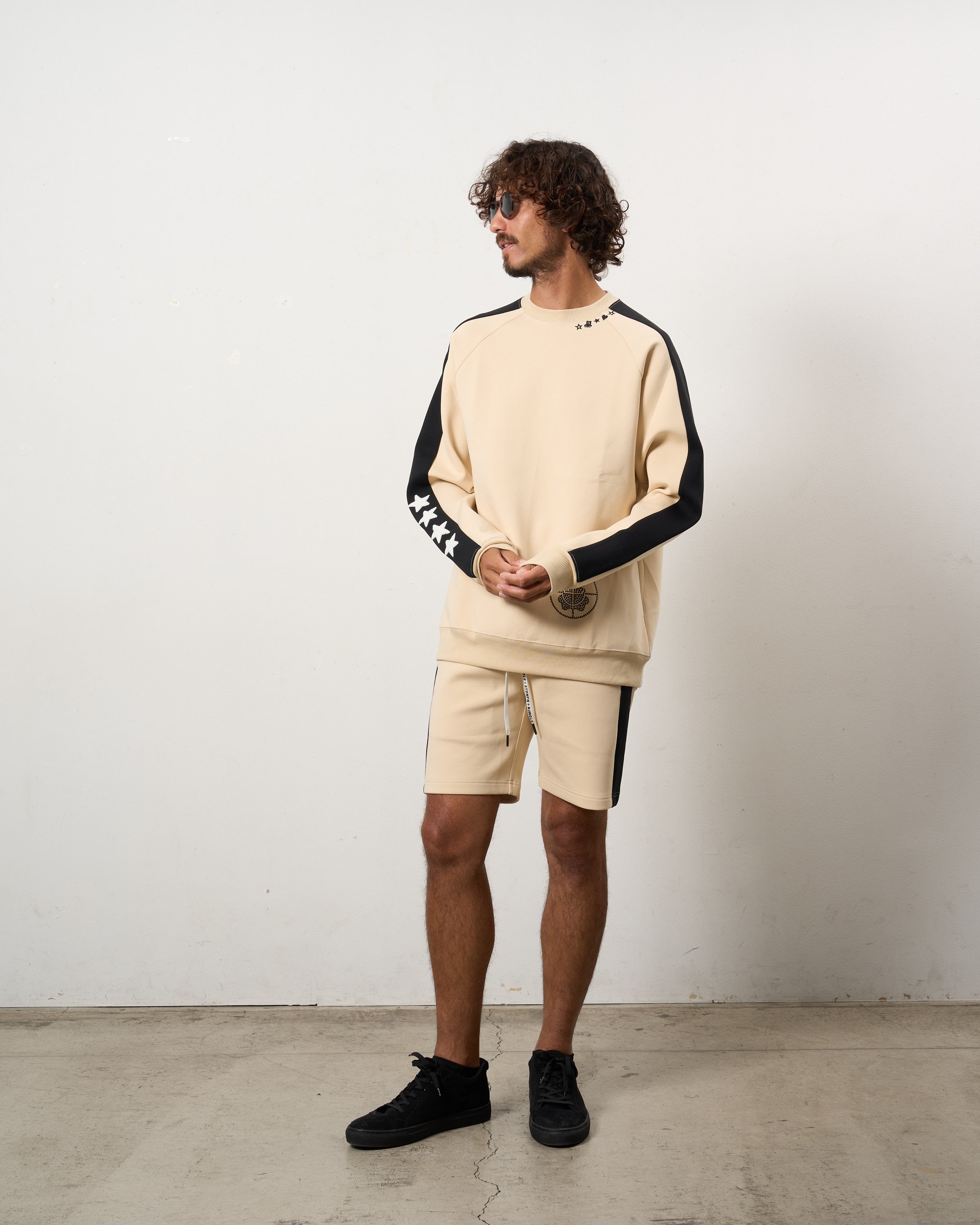 TRストレッチポンチ ラインストーン ターゲットベア ラインスエットシャツ