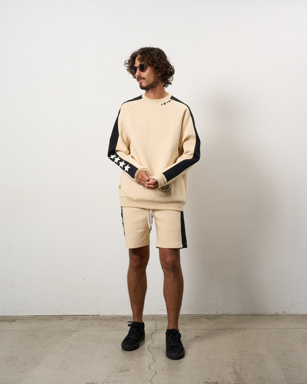 TRストレッチポンチ ラインストーン ターゲットベア ラインスエットシャツ