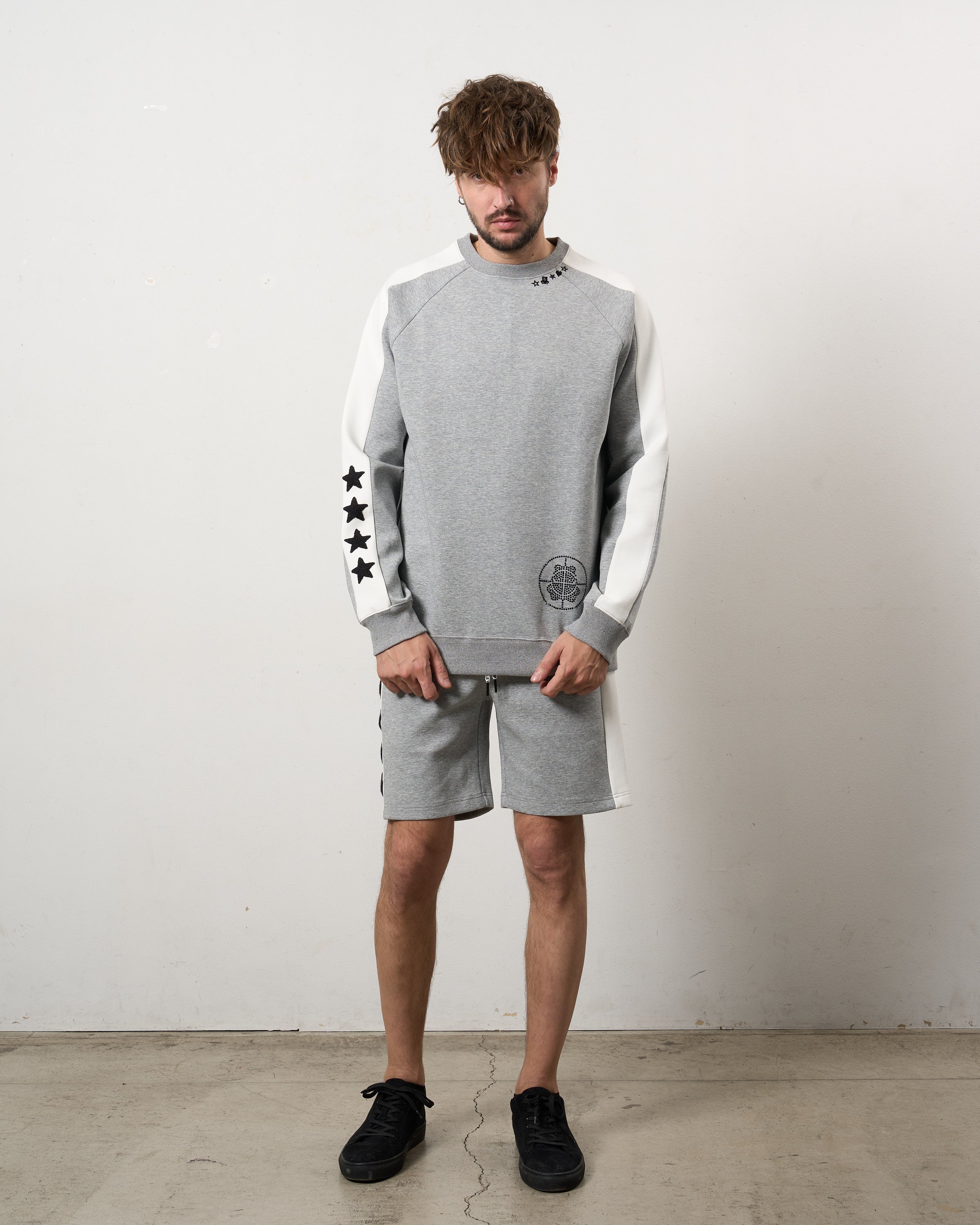 TRストレッチポンチ ラインストーン ターゲットベア ラインスエットシャツ