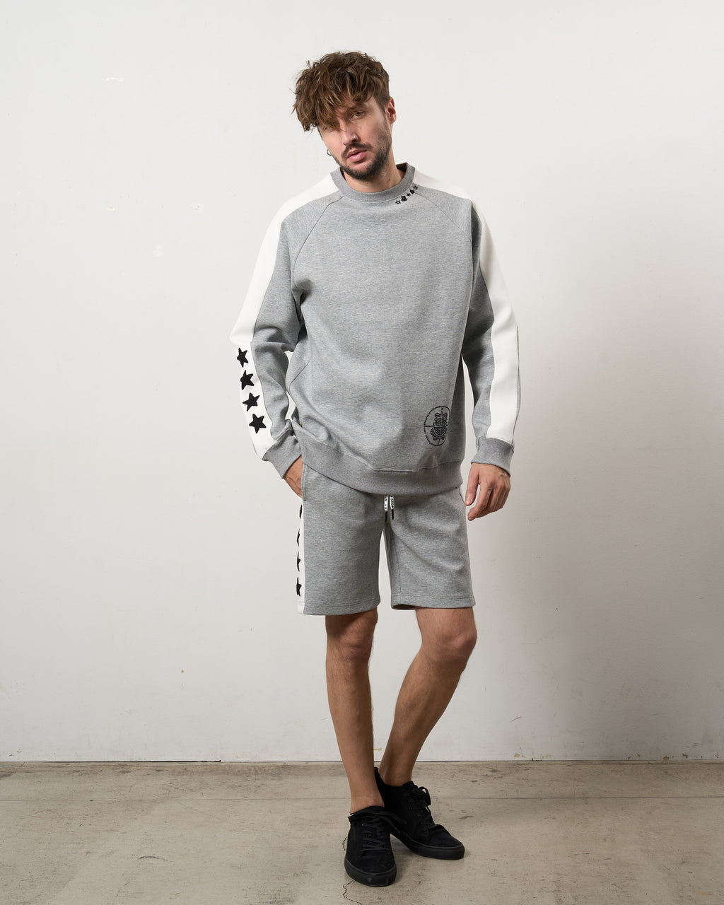 TRストレッチポンチ ラインストーン ターゲットベア ラインスエットシャツ