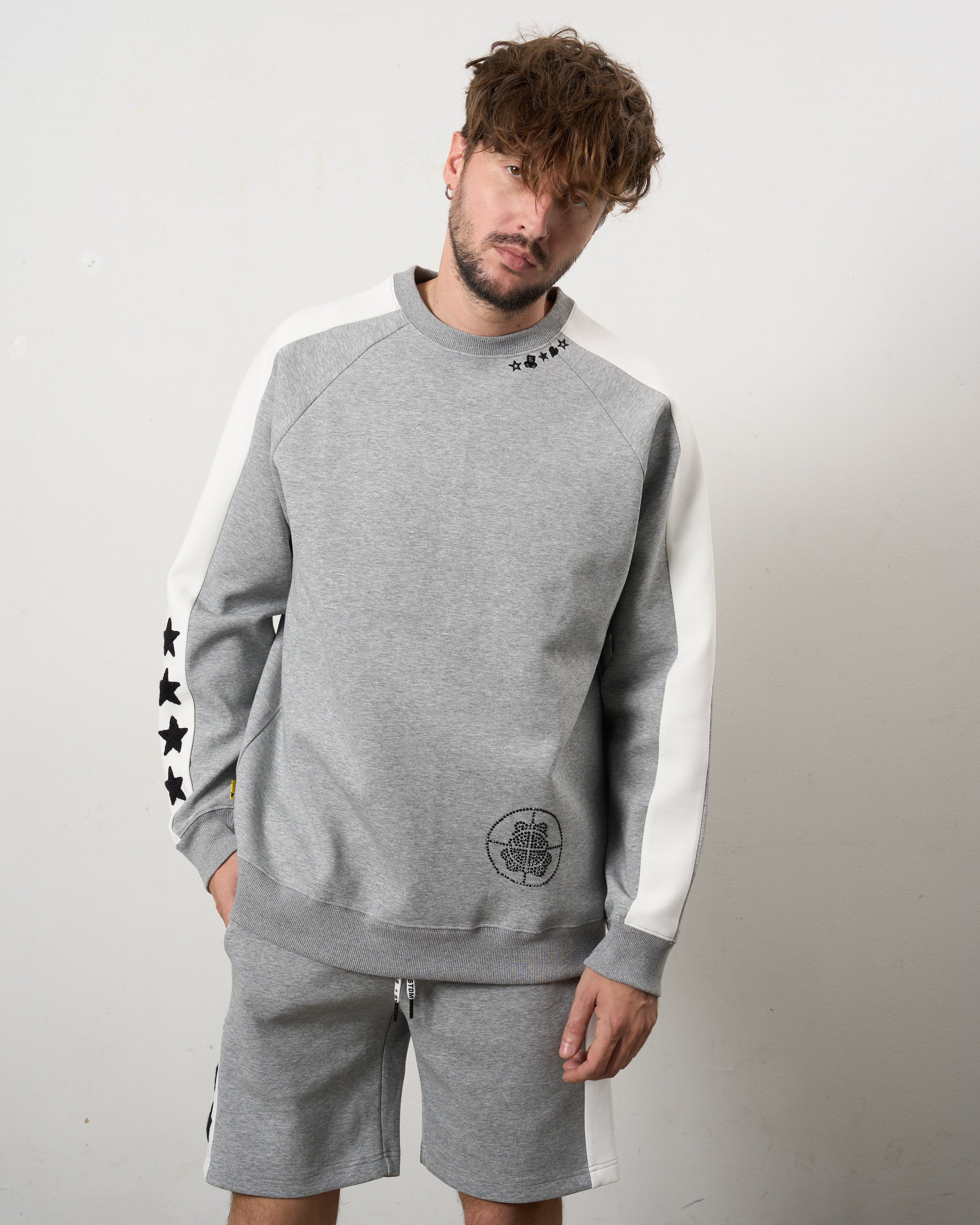 TRストレッチポンチ ラインストーン ターゲットベア ラインスエットシャツ