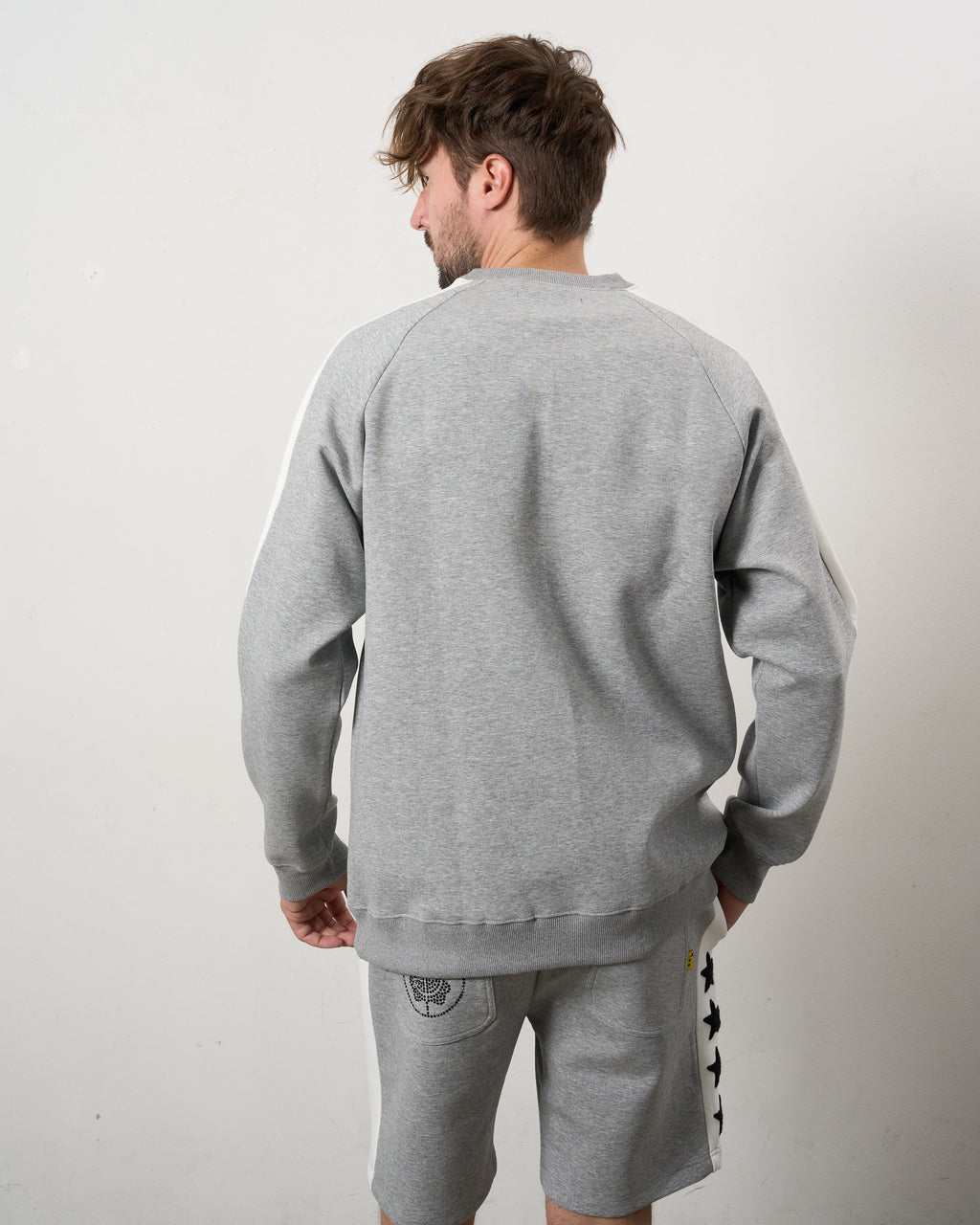 TRストレッチポンチ ラインストーン ターゲットベア ラインスエットシャツ