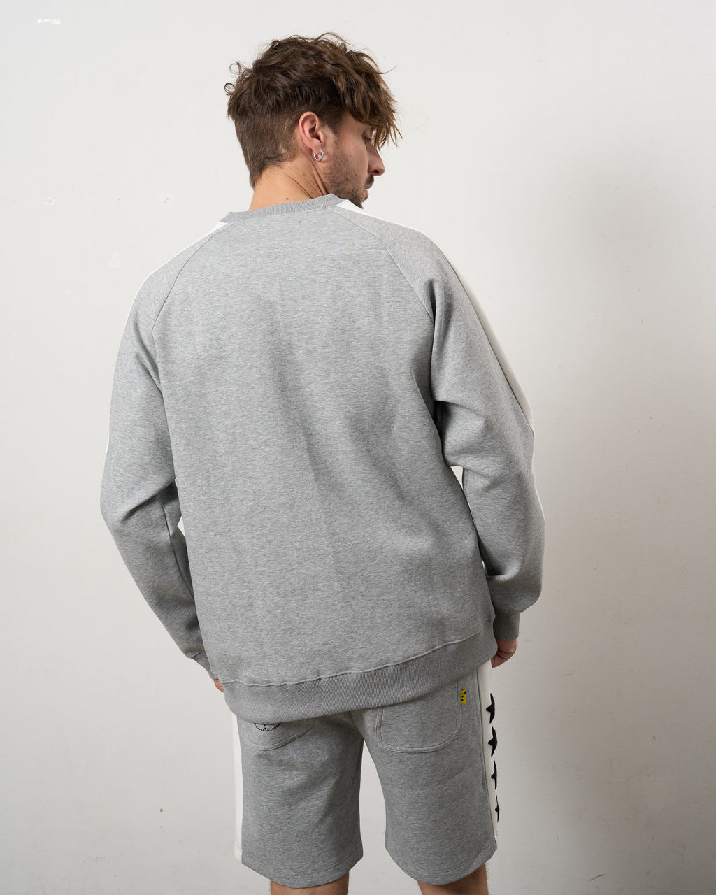 TRストレッチポンチ ラインストーン ターゲットベア ラインスエットシャツ